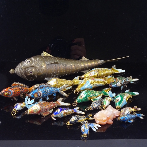 220 - A collection of brass and enamel articulated fish, largest length 22cm