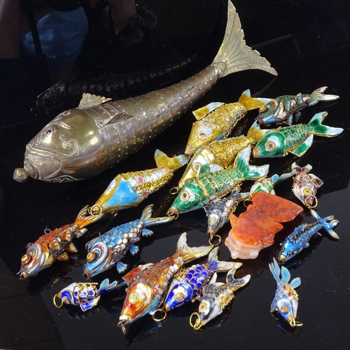 220 - A collection of brass and enamel articulated fish, largest length 22cm