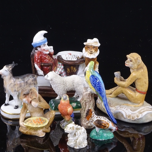 221 - A group of mainly 19th century porcelain animals, including Mr Punch match striker, length 8cm