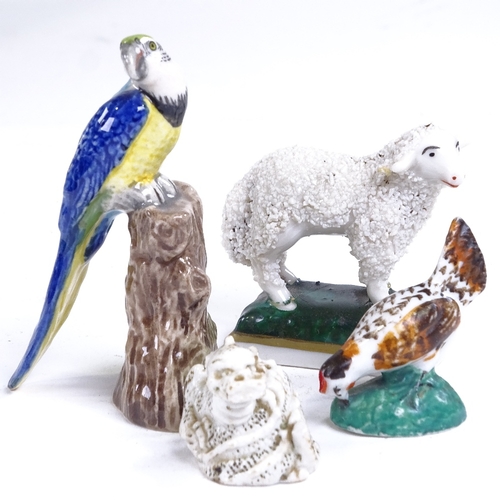 221 - A group of mainly 19th century porcelain animals, including Mr Punch match striker, length 8cm