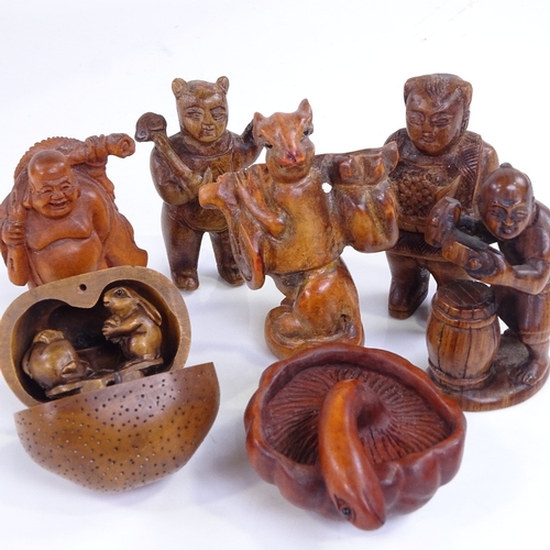 222 - A group of Japanese carved wood netsuke and okimono, including a rat carrying a backpack, height 6cm