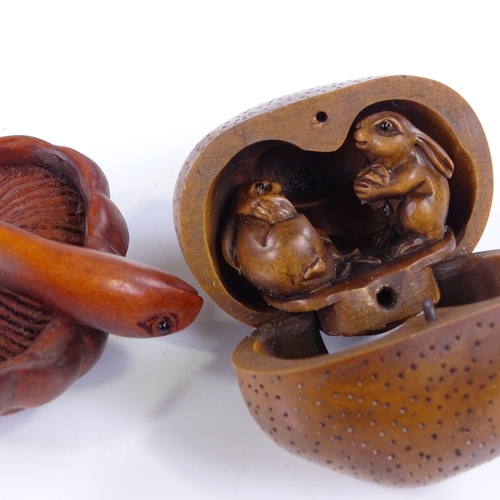 222 - A group of Japanese carved wood netsuke and okimono, including a rat carrying a backpack, height 6cm