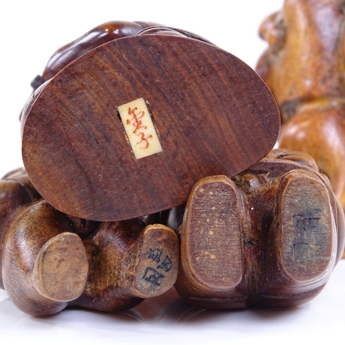 222 - A group of Japanese carved wood netsuke and okimono, including a rat carrying a backpack, height 6cm