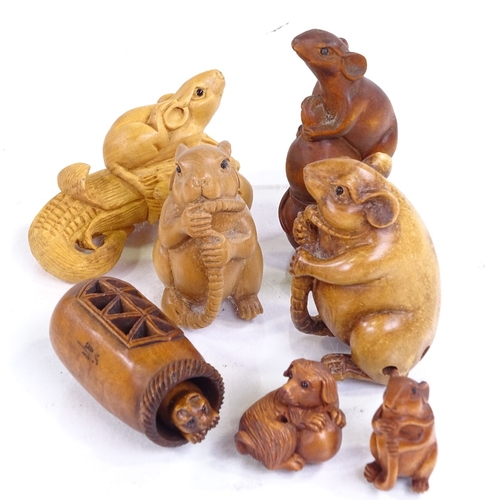 224 - A group of Japanese carved wood netsuke, including a rat holding his tail, height 5cm