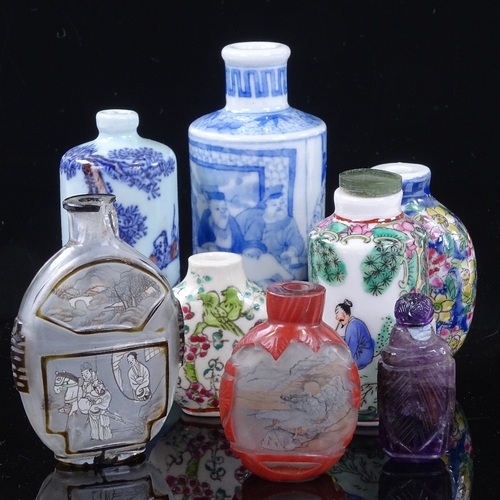 227 - A group of Chinese porcelain stone and Peking glass snuff bottles, largest blue and white bottle hei... 