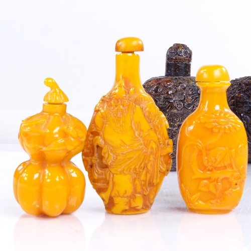 229 - A group of Chinese relief carved amber snuff bottles, largest height 8cm (6)