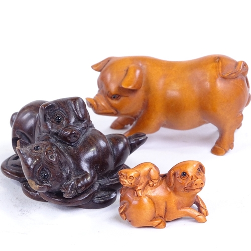 231 - 3 Japanese carved wood pig netsuke, largest length 5.5cm (3)