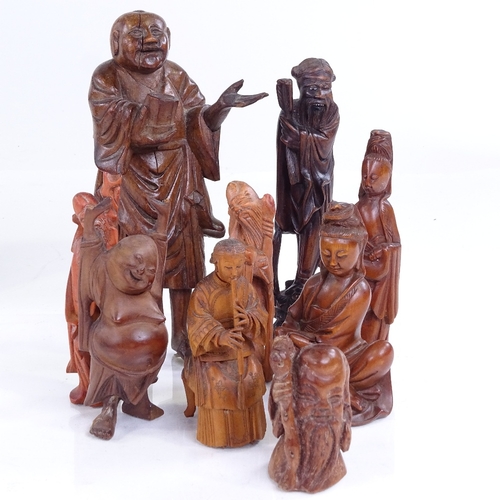 237 - A group of Oriental carved wood standing figures, largest height 17cm