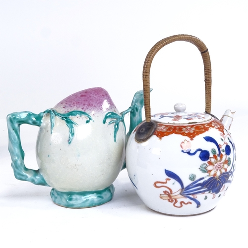 256 - A group of Chinese porcelain teapots and cups, including a fruit design Cadogan teapot, height 12cm