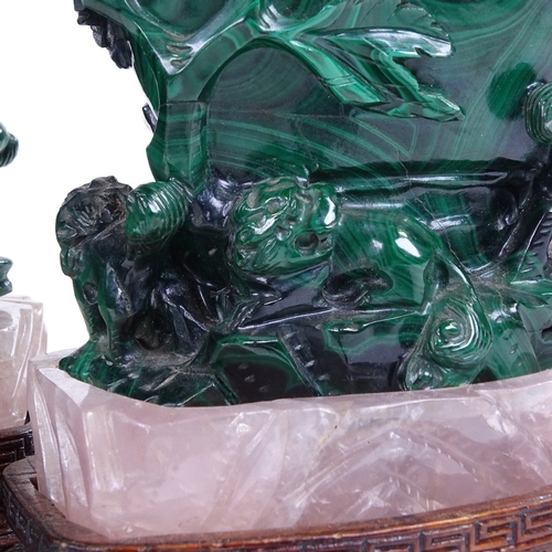 257 - A pair of Chinese relief carved malachite pots and covers on rose quartz and hardwood stands, height... 