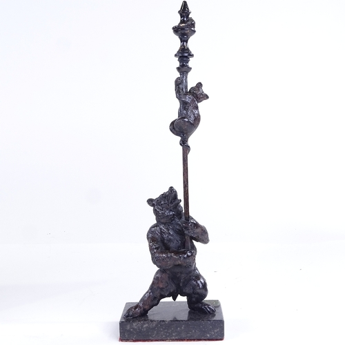 259 - A patinated bronze bear with cat on a pole, on marble base, height 32cm