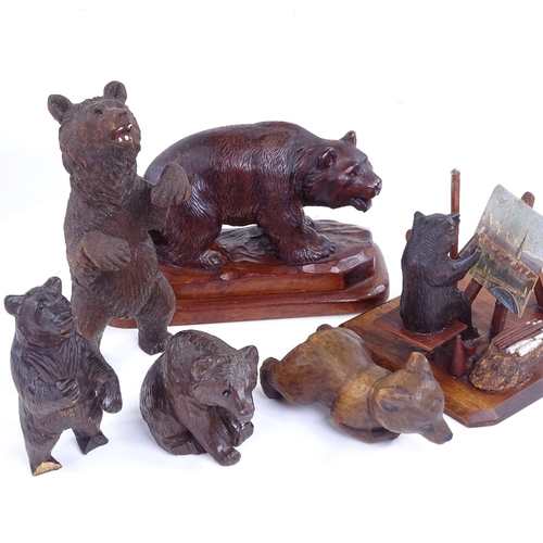 261 - A group of 19th century Black Forest carved wood bears, including an artist bear painting a picture,... 