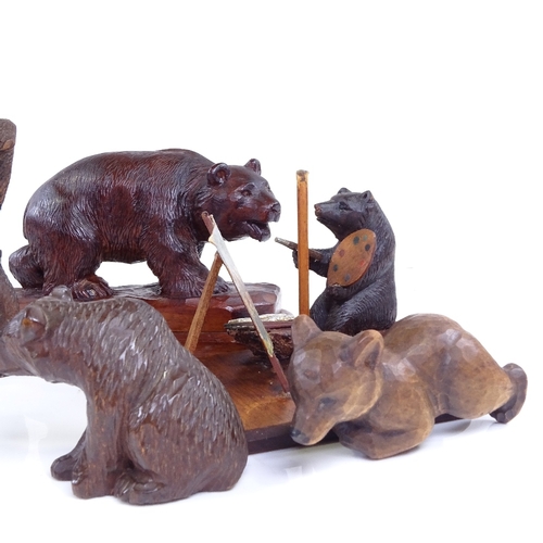 261 - A group of 19th century Black Forest carved wood bears, including an artist bear painting a picture,... 