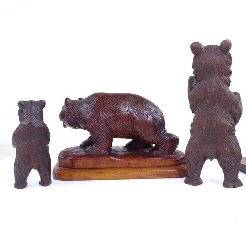 261 - A group of 19th century Black Forest carved wood bears, including an artist bear painting a picture,... 