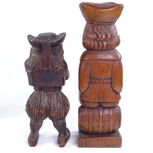 263 - A pair of carved oak Toby figure candle stands, height 22cm, and 2 other wood carvings (4)