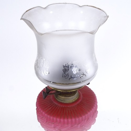 321 - A brass and pink opalescent glass oil lamp, with etched glass shade, overall height including shade ... 