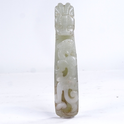 323 - A Chinese relief carved jade dragon design buckle, length 11.5cm