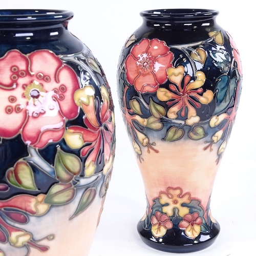 324 - A pair of Moorcroft Pottery vases, height 31cm, 1993