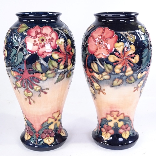 324 - A pair of Moorcroft Pottery vases, height 31cm, 1993