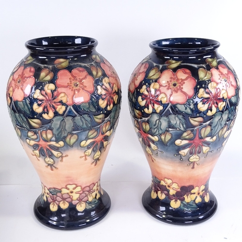 325 - A large pair of Moorcroft Pottery vases, dated 1995, height 41cm