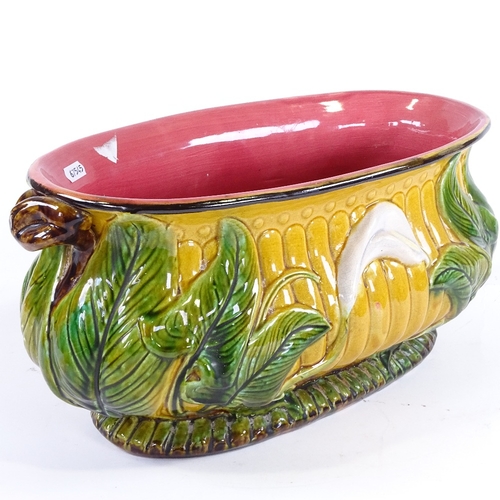 365 - A 19th century Majolica Pottery oval jardiniere, with relief moulded lily flower designs, no factory... 