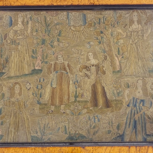 370 - An 18th century silk needlework embroidery, depicting ladies in an orchard, maple frame, overall dim... 