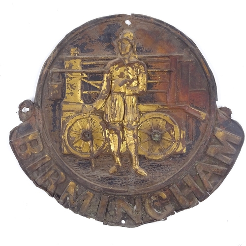 373 - A 19th century embossed brass Birmingham fire mark, depicting a fireman and engine, height 26cm