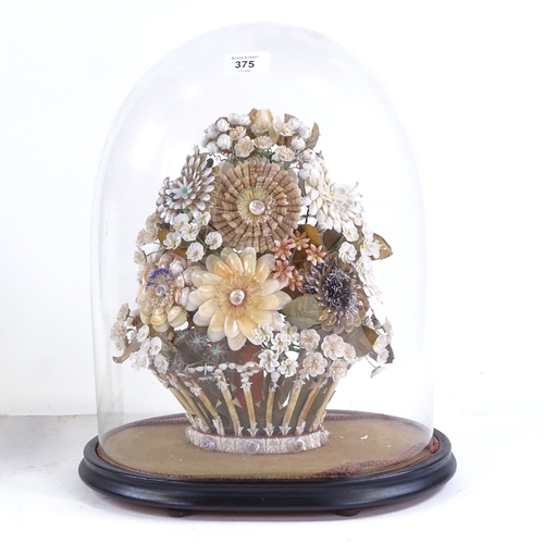 375 - A 19th century floral shell display under glass dome, overall height 42cm