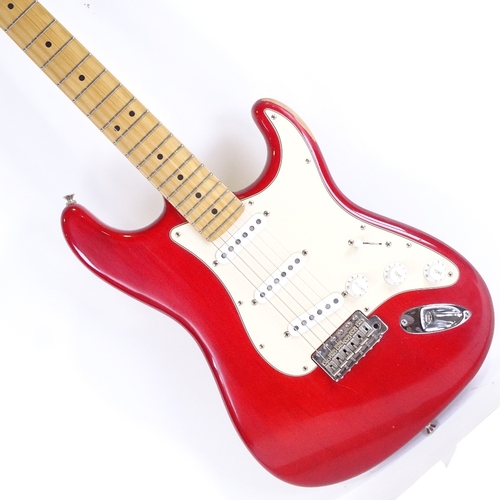 377 - A Fender Stratocaster red electric guitar, serial no. Z4039095, circa 2000, with Fender case