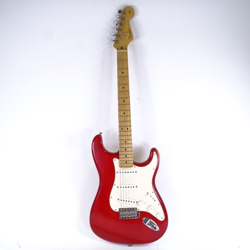 377 - A Fender Stratocaster red electric guitar, serial no. Z4039095, circa 2000, with Fender case