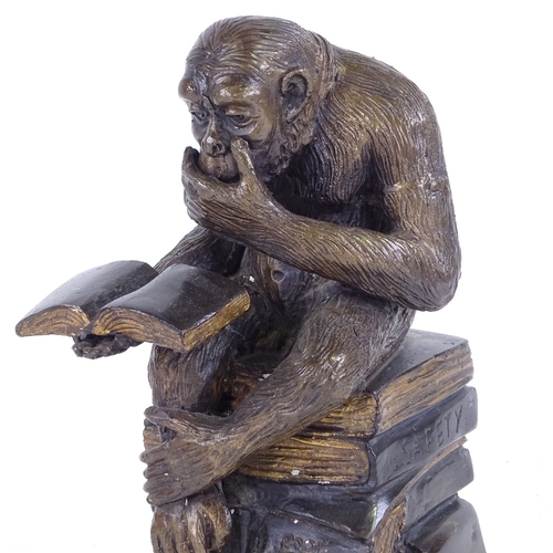 389 - After Bonheur, a patinated bronze sculpture, monkey reading, height 26cm