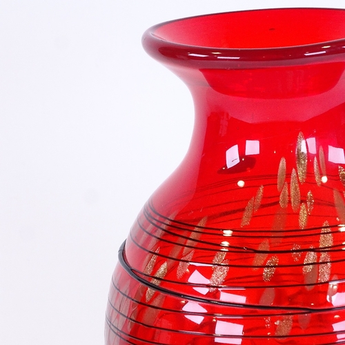 416 - A large Murano red glass vase with black trail decoration, height 33cm