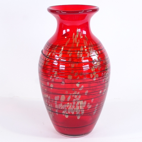 416 - A large Murano red glass vase with black trail decoration, height 33cm