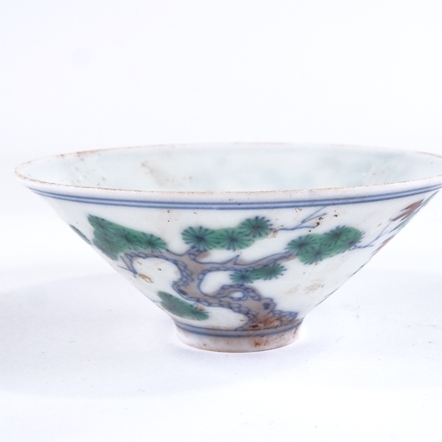 428 - A Chinese porcelain tea bowl with painted blossom tree designs, 6 character mark, diameter 8.5cm