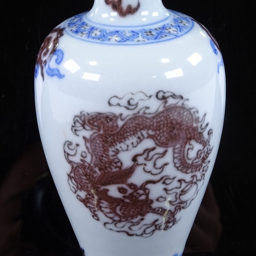 430 - A small Chinese porcelain vase with painted dragon design, height 14.5cm