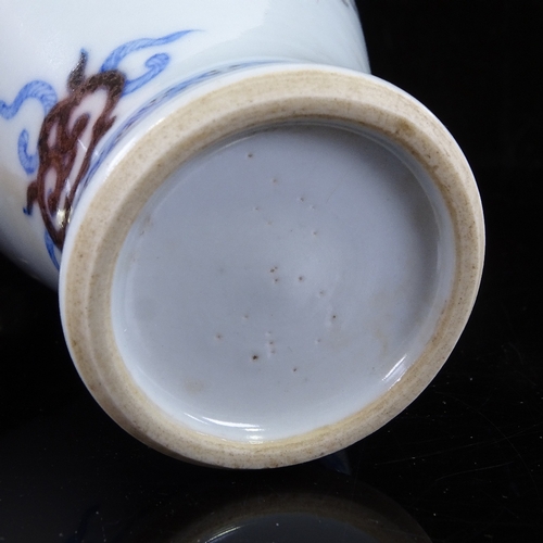 430 - A small Chinese porcelain vase with painted dragon design, height 14.5cm