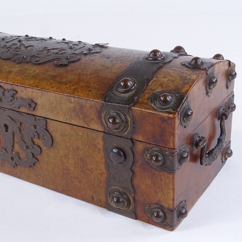 441 - A Victorian burr-walnut dome-top box with engraved brass strapwork mounts, brass bosses and drop han... 