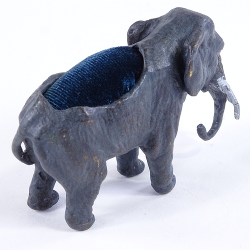 443 - A cold painted bronze elephant design pin cushion, length 7cm