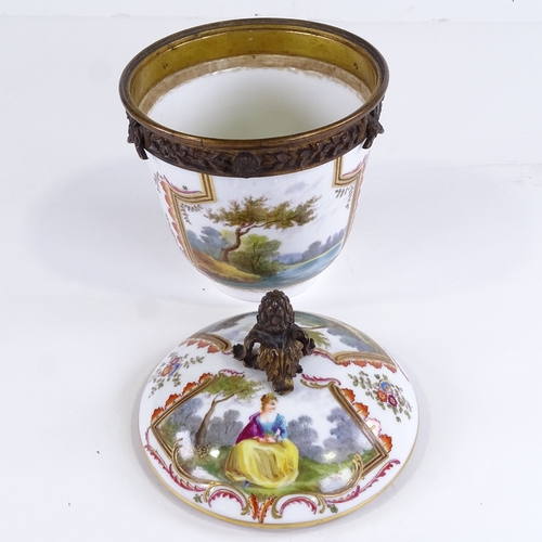 446 - A late 19th century German porcelain urn and cover, with painted and gilded decoration, and gilt-bro... 