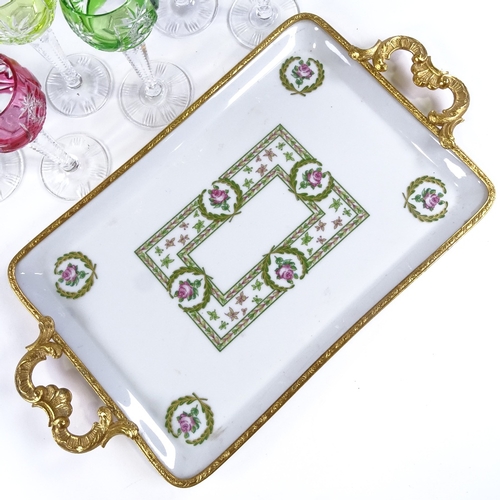 447 - A Limoges porcelain tray with ormolu edge and handles, 27cm x 18.5cm excluding handles, and a harleq... 