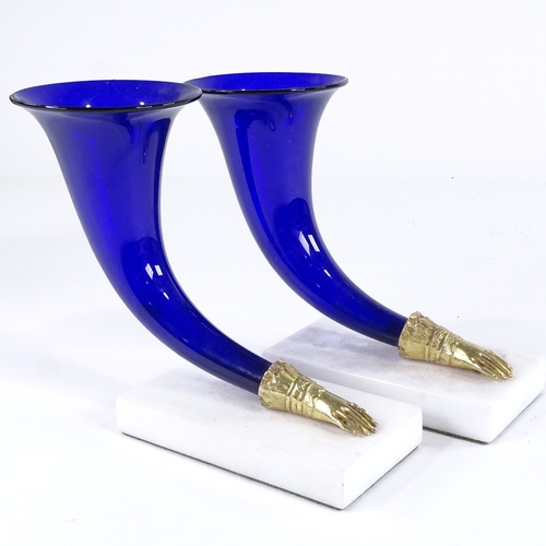 460 - A pair of Bristol blue glass cornucopia vases, on white marble bases, height 17cm