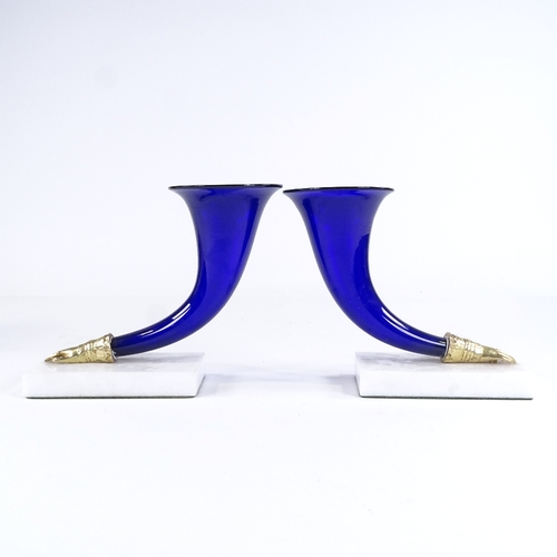 460 - A pair of Bristol blue glass cornucopia vases, on white marble bases, height 17cm