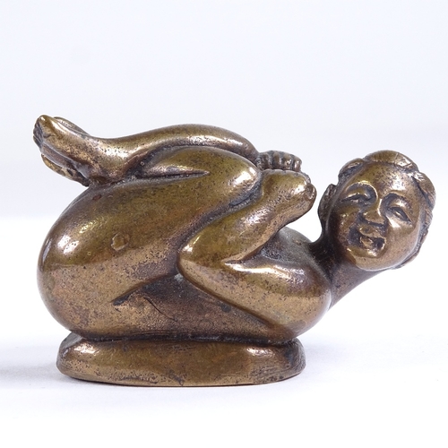 480 - A Japanese erotic bronze crouching figure, length 5.5cm