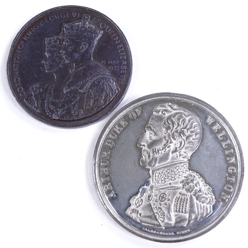 489 - A Duke of Wellington commemorative medallion, and a 1937 Coronation commemorative medallion (2)