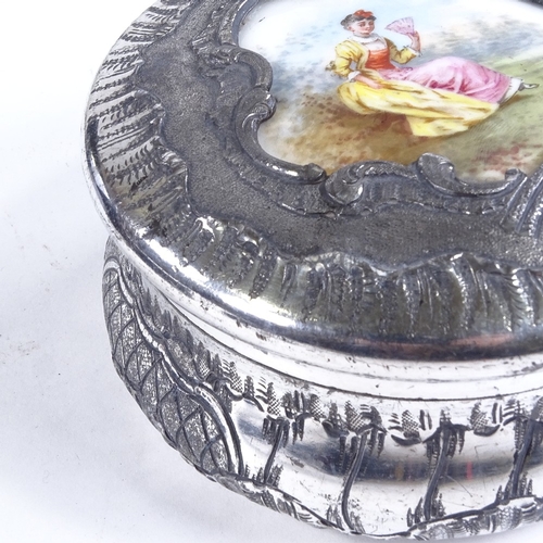 503 - A French nickel plate circular box, with inset porcelain plaque to the lid, diameter 12cm