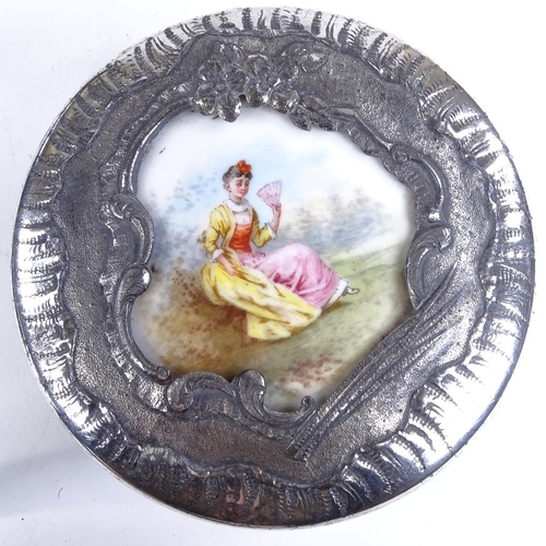 503 - A French nickel plate circular box, with inset porcelain plaque to the lid, diameter 12cm