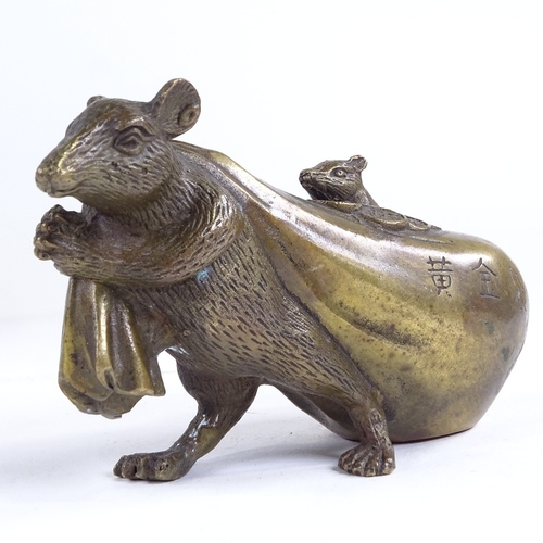 505 - A Chinese bronze rat carrying a bag, inscribed, length 13cm