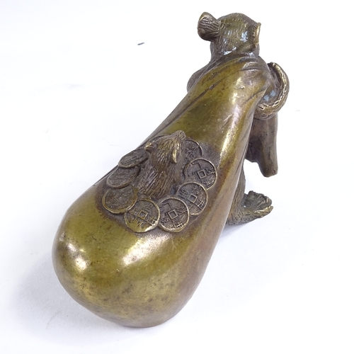 505 - A Chinese bronze rat carrying a bag, inscribed, length 13cm