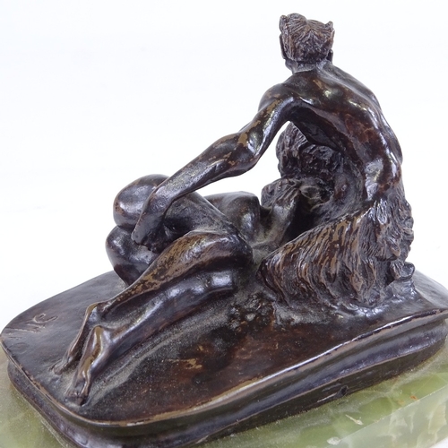 516 - A patinated bronze sculpture, erotic composition, signed with monogram SM, onyx base, base length 13... 