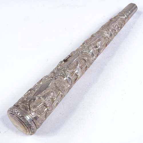 525 - An Indian relief embossed silver parasol/walking stick handle, length 23cm